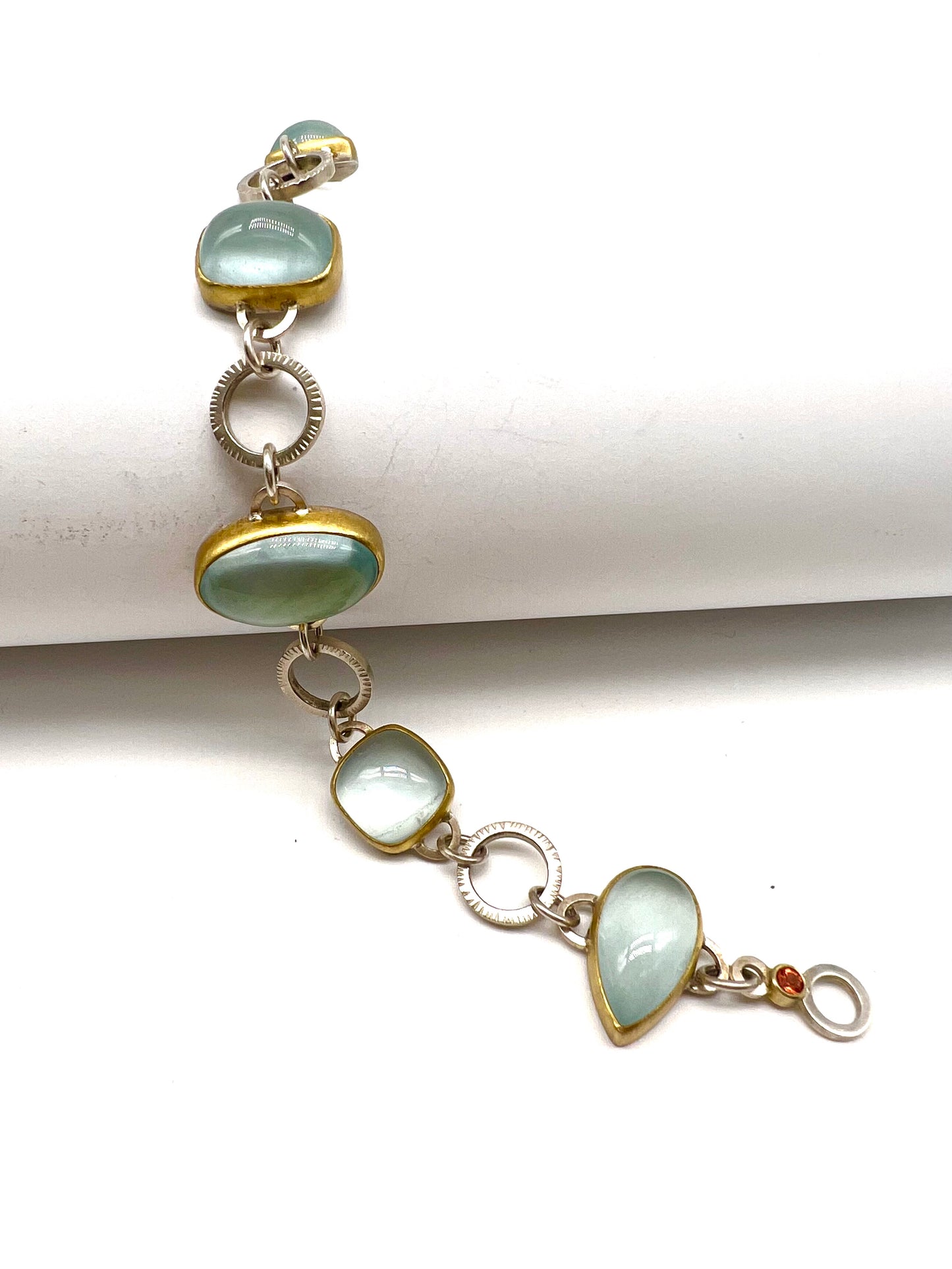 Cabochon Aquamarine, Orange Sapphire, 22kt Yellow Gold and Sterling Silver link bracelet