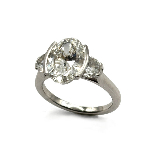 18K White Gold Oval Diamond & Half-Moon Side three-stone Diamond Ring