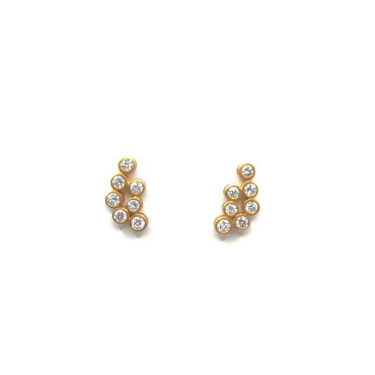 Pair of gold earrings with small diamonds on a white background