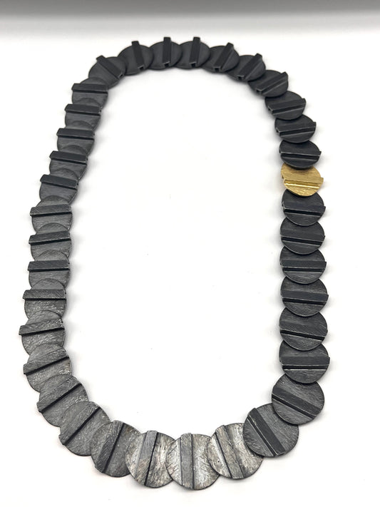 Oxidized Sterling Silver and 18kt Gold carved Oval Disc Necklace
